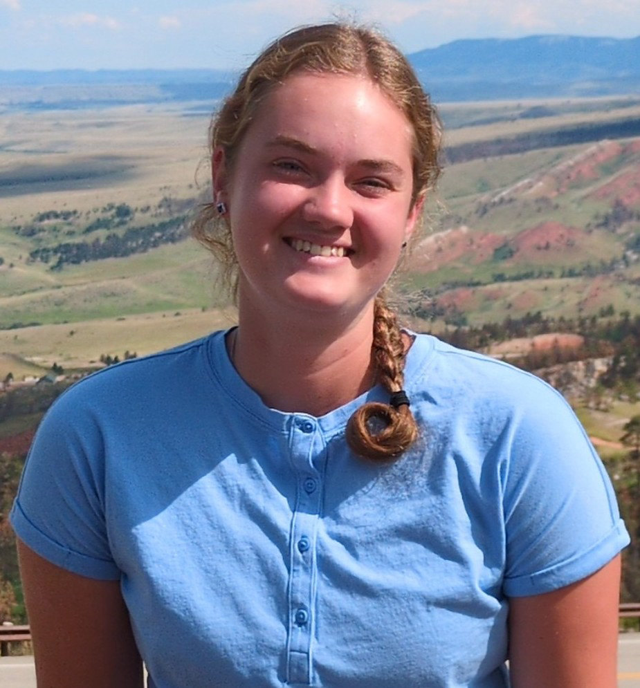 The owner of Magic Fairy Housecleaning, smiling outdoors